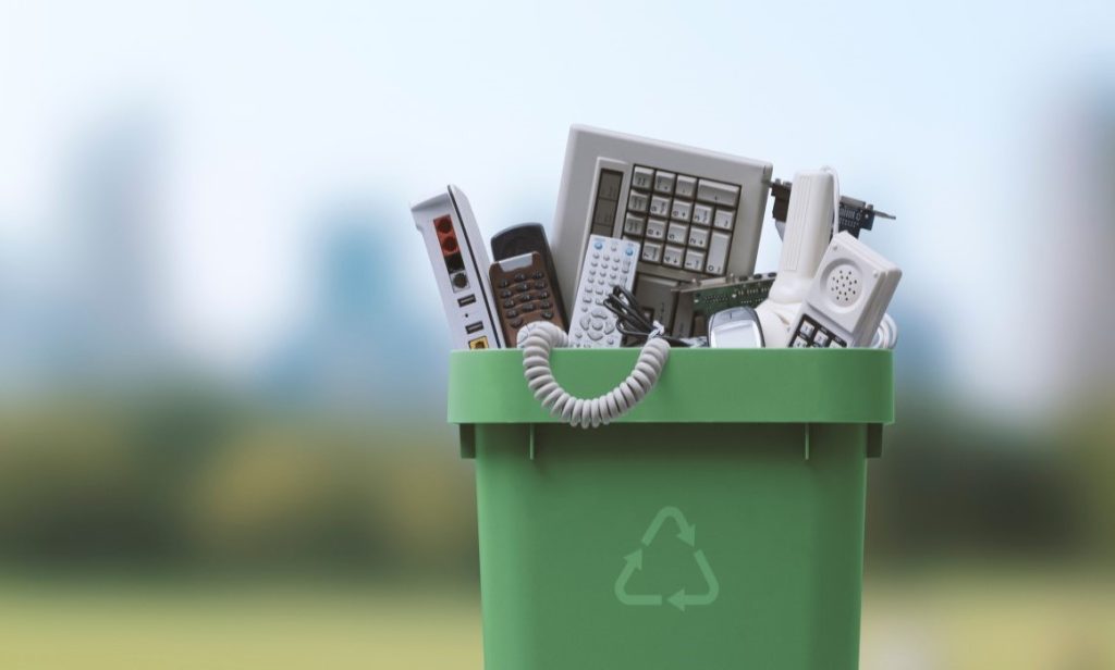 image of Green bin with e-waste for recycling